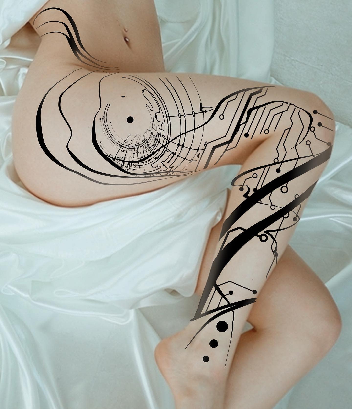 Stylized cyberpunk tattoo on leg featuring abstract circuit patterns and bold black lines, extending from thigh to lower leg